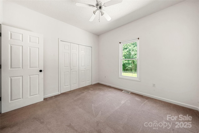 814 Carved Oak Ct, York, SC 29745 - unfurnished bedroom featuring carpet, a closet, and a ceiling fan