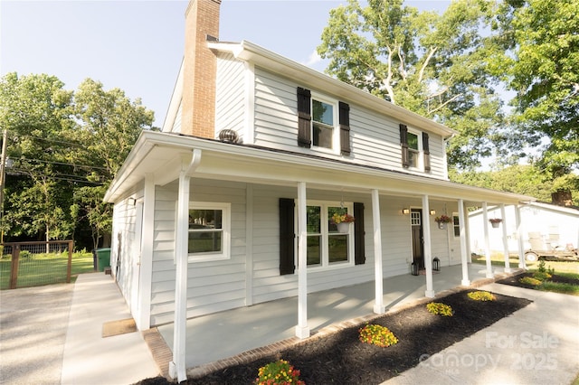 8012 Red Lantern Rd, Indian Trail, NC 28079 - view of side of home featuring a chimney and a porch