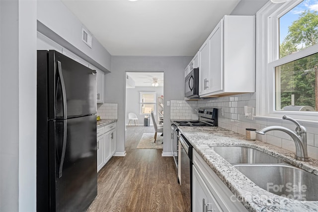 8012 Red Lantern Rd, Indian Trail, NC 28079 - kitchen featuring black appliances, dark wood-style floors, white cabinetry, and a ceiling fan