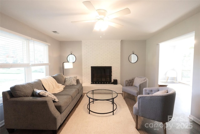 8012 Red Lantern Rd, Indian Trail, NC 28079 - living room featuring a ceiling fan and a brick fireplace