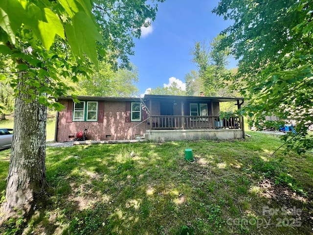 387 Sheep Rock Cove Rd, Whittier, NC 28789 - ranch-style home with crawl space, a front lawn, brick siding, and a porch