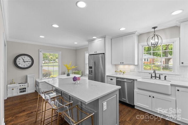 5501 Murrayhill Rd, Charlotte, NC 28210 - kitchen featuring stainless steel appliances, dark wood-style floors, tasteful backsplash, a center island, and recessed lighting
