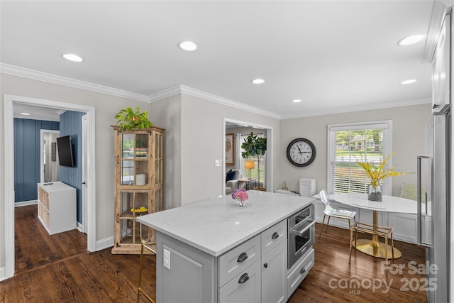 5501 Murrayhill Rd, Charlotte, NC 28210 - kitchen featuring dark wood-style floors, light stone countertops, recessed lighting, a kitchen island, and stainless steel appliances