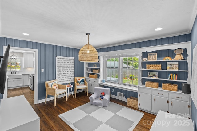5501 Murrayhill Rd, Charlotte, NC 28210 - playroom featuring ornamental molding, dark wood-type flooring, and recessed lighting