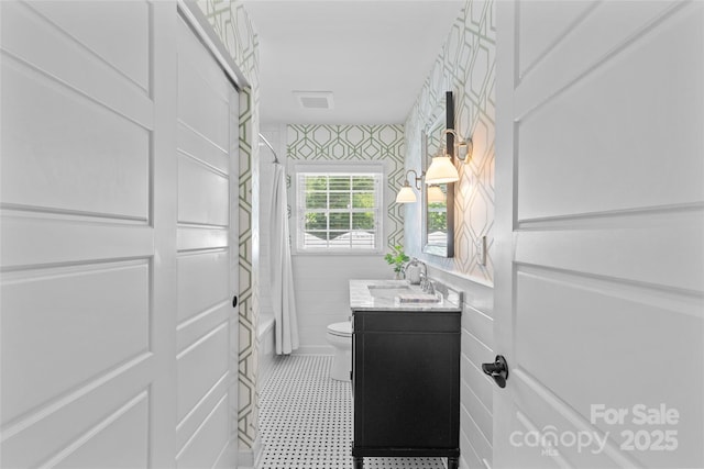 5501 Murrayhill Rd, Charlotte, NC 28210 - bathroom with vanity, shower / bathtub combination with curtain, tile patterned floors, and tile walls