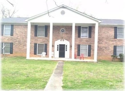 153 W End St, Chester, SC 29706 - greek revival house with a front lawn and covered porch