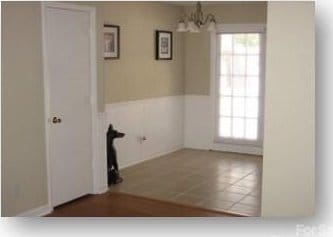 153 W End St, Chester, SC 29706 - unfurnished dining area with a chandelier and healthy amount of natural light