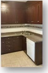 153 W End St, Chester, SC 29706 - kitchen featuring dark brown cabinets and light tile patterned flooring