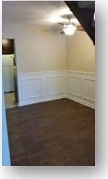 153 W End St, Chester, SC 29706 - spare room featuring wainscoting and a decorative wall