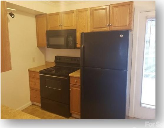 153 W End St, Chester, SC 29706 - kitchen with black appliances and light countertops