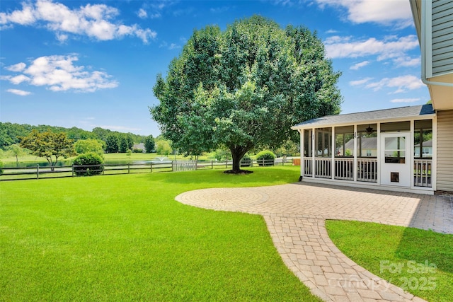 2004 Onotoa Dr, Indian Trail, NC 28079 - view of yard with a sunroom, a patio area, and a ceiling fan