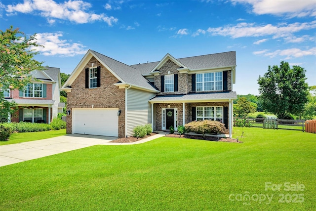 2004 Onotoa Dr, Indian Trail, NC 28079 - traditional-style house featuring an attached garage, driveway, brick siding, and a shingled roof