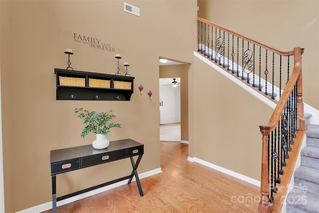 2004 Onotoa Dr, Indian Trail, NC 28079 - hall featuring wood finished floors and stairway