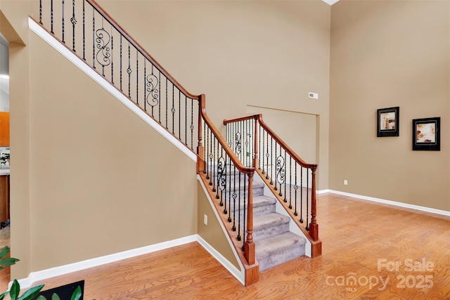 2004 Onotoa Dr, Indian Trail, NC 28079 - stairway featuring wood finished floors and a towering ceiling
