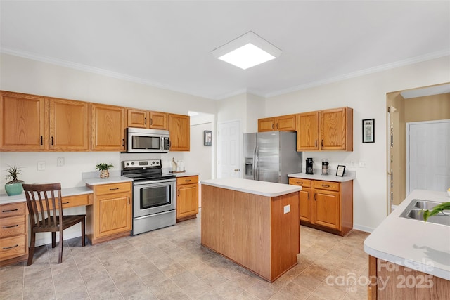 2004 Onotoa Dr, Indian Trail, NC 28079 - kitchen featuring appliances with stainless steel finishes, crown molding, light countertops, and a center island