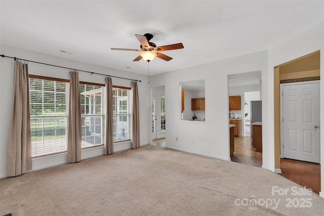 2004 Onotoa Dr, Indian Trail, NC 28079 - spare room with a ceiling fan, light carpet, and plenty of natural light