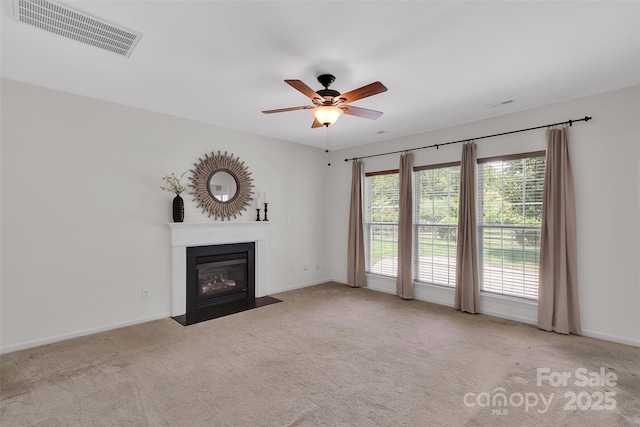 2004 Onotoa Dr, Indian Trail, NC 28079 - unfurnished living room featuring ceiling fan, a fireplace with flush hearth, and carpet floors
