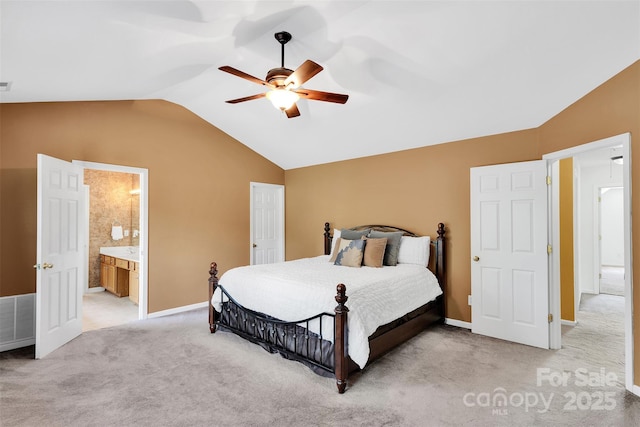 2004 Onotoa Dr, Indian Trail, NC 28079 - bedroom featuring lofted ceiling, light carpet, a ceiling fan, and ensuite bathroom