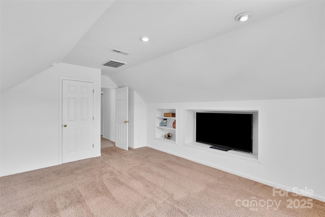 2004 Onotoa Dr, Indian Trail, NC 28079 - additional living space with carpet, lofted ceiling, built in shelves, and recessed lighting