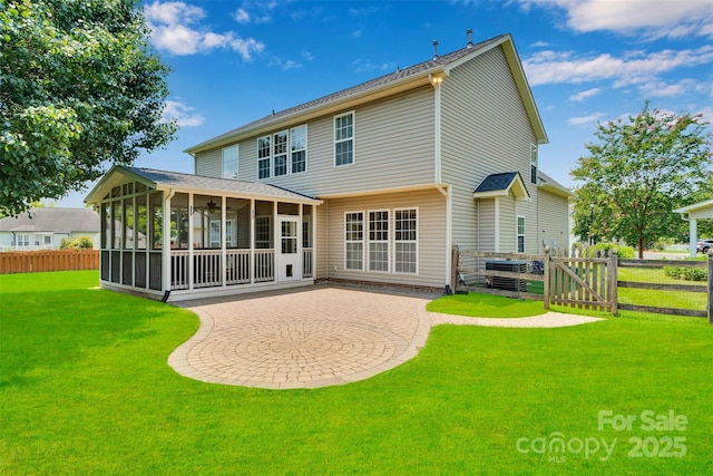 2004 Onotoa Dr, Indian Trail, NC 28079 - rear view of property featuring a sunroom, a fenced backyard, and a patio