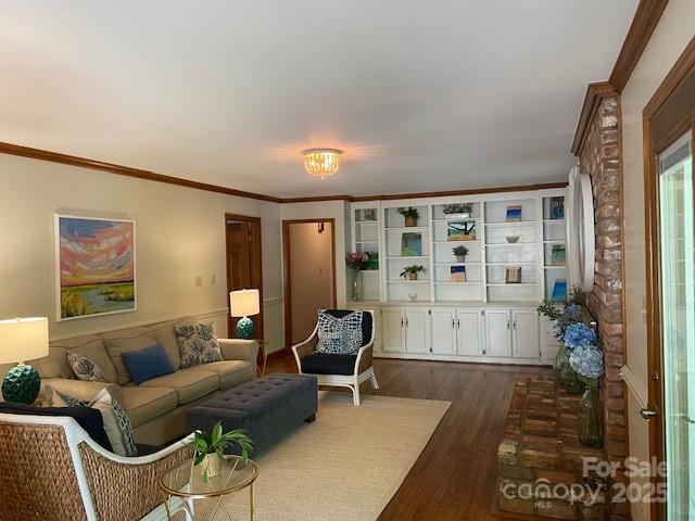 6632 Summer Darby Ln, Charlotte, NC 28270 - living area with ornamental molding and dark wood-type flooring