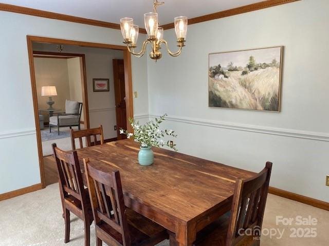 6632 Summer Darby Ln, Charlotte, NC 28270 - dining area featuring ornamental molding, a chandelier, and light colored carpet