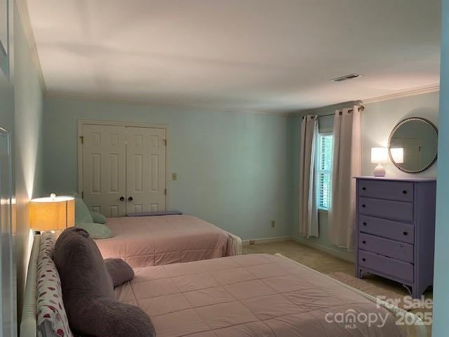 6632 Summer Darby Ln, Charlotte, NC 28270 - carpeted bedroom with ornamental molding and a closet