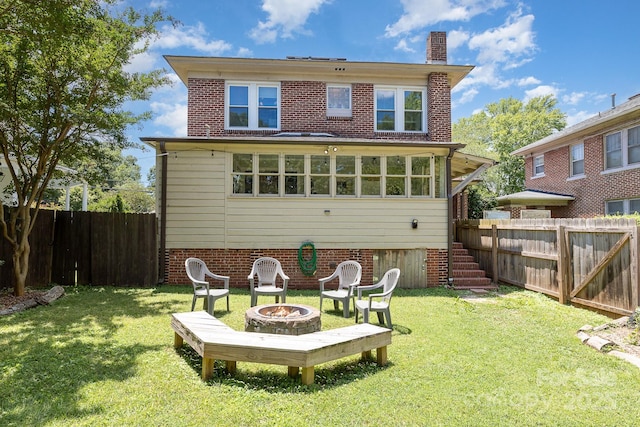 206 Mitchell Ave, Salisbury, NC 28144 - rear view of property with a fire pit, a chimney, a fenced backyard, and stairway