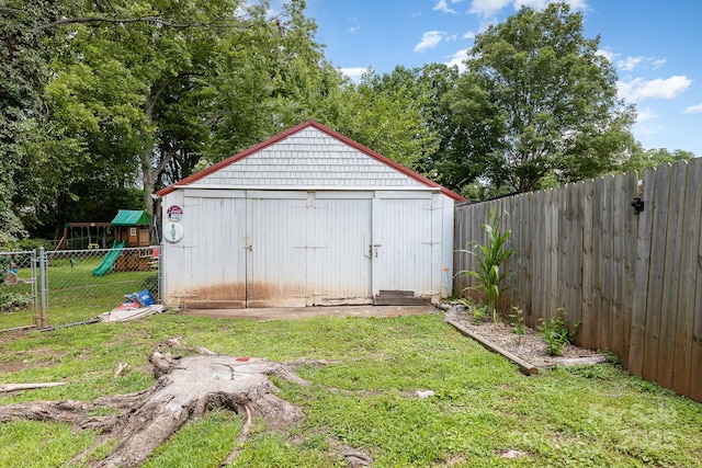 206 Mitchell Ave, Salisbury, NC 28144 - view of shed with a fenced backyard and a playground