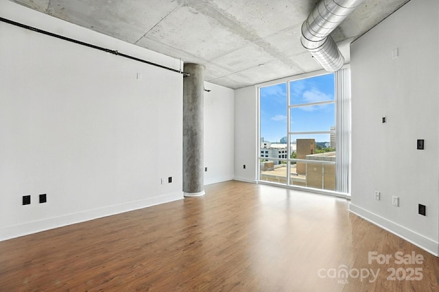 505 E 6th St Unit 908, Charlotte, NC 28202 - empty room with wood finished floors and floor to ceiling windows