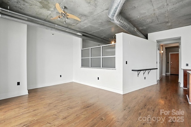505 E 6th St Unit 908, Charlotte, NC 28202 - empty room with wood finished floors and ceiling fan