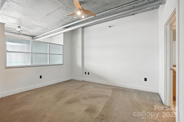 505 E 6th St Unit 908, Charlotte, NC 28202 - spare room with a ceiling fan and carpet floors
