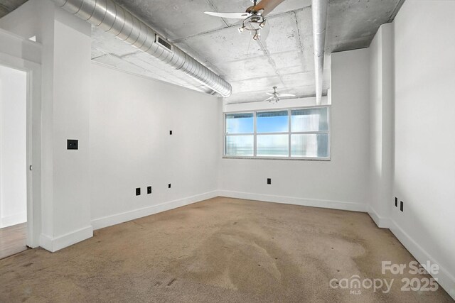 505 E 6th St Unit 908, Charlotte, NC 28202 - empty room featuring a ceiling fan and baseboards