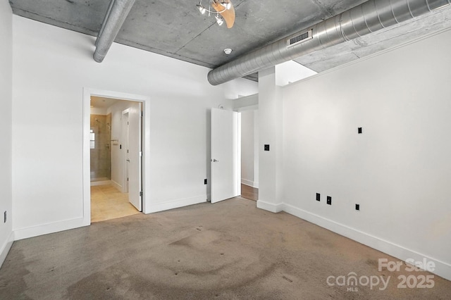 505 E 6th St Unit 908, Charlotte, NC 28202 - basement featuring baseboards and carpet flooring