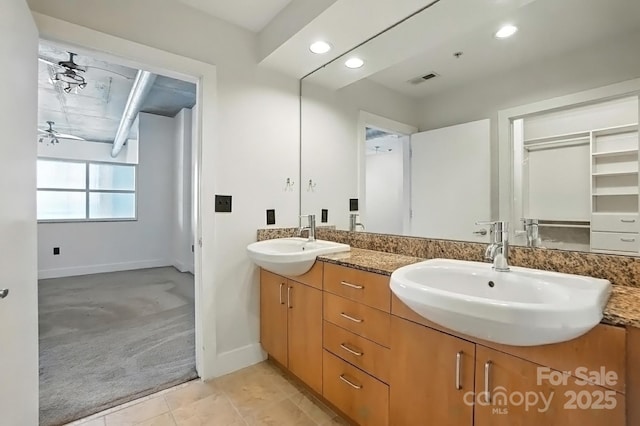 505 E 6th St Unit 908, Charlotte, NC 28202 - bathroom with double vanity, a ceiling fan, recessed lighting, and tile patterned flooring
