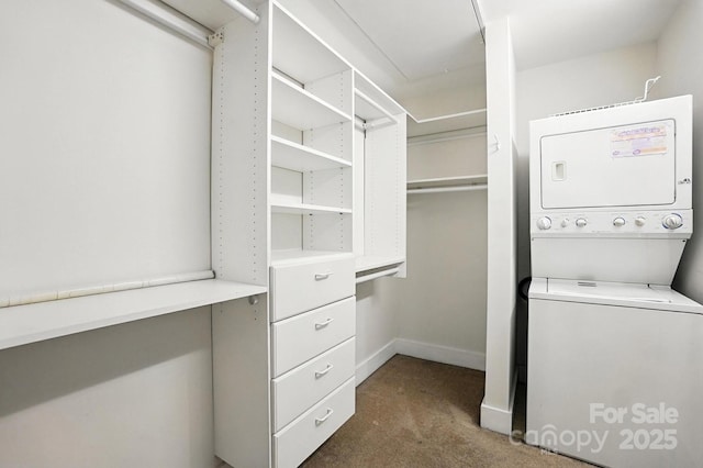 505 E 6th St Unit 908, Charlotte, NC 28202 - walk in closet featuring stacked washer / drying machine and carpet flooring