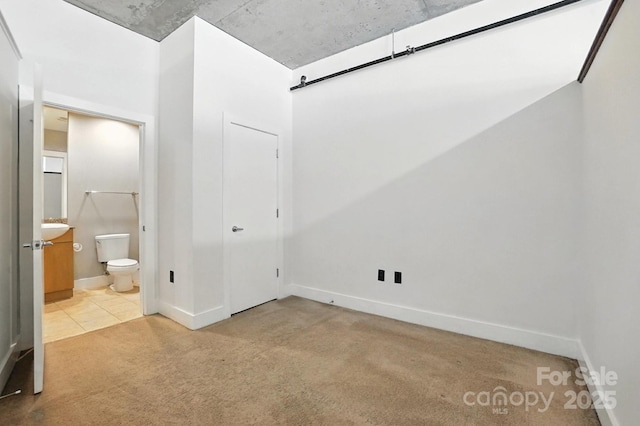 505 E 6th St Unit 908, Charlotte, NC 28202 - unfurnished bedroom with carpet flooring and ensuite bathroom