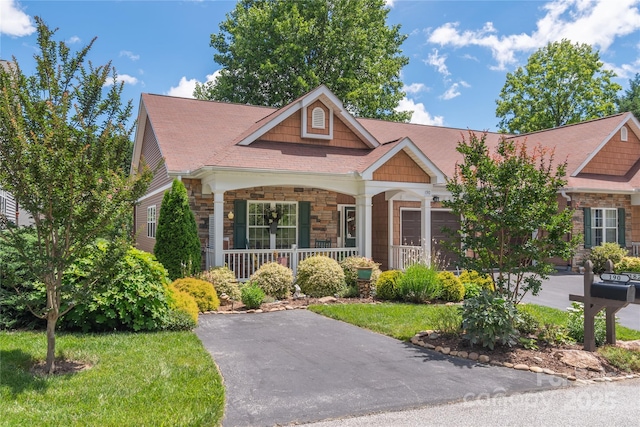 190 Shaws Creek Farm Rd, Hendersonville, NC 28739 - craftsman house with a porch, stone siding, and a front yard