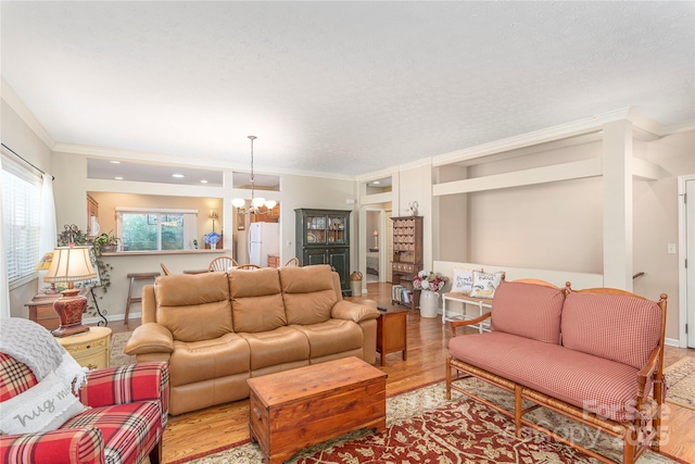 190 Shaws Creek Farm Rd, Hendersonville, NC 28739 - living area with light wood-style flooring, a chandelier, and crown molding