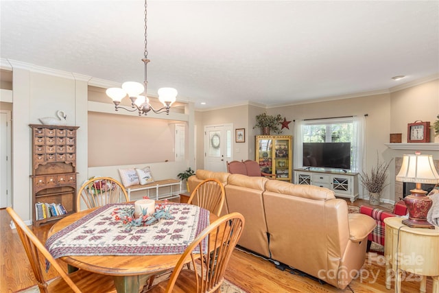190 Shaws Creek Farm Rd, Hendersonville, NC 28739 - dining space featuring a chandelier, light wood finished floors, and crown molding