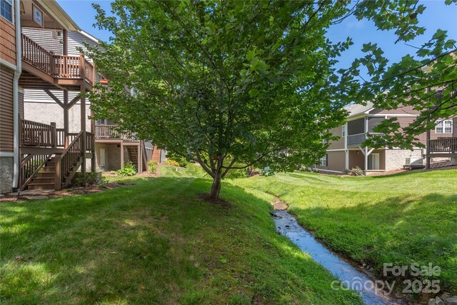 190 Shaws Creek Farm Rd, Hendersonville, NC 28739 - view of grassy yard with stairs and a wooden deck