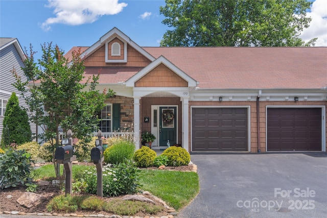 190 Shaws Creek Farm Rd, Hendersonville, NC 28739 - craftsman house featuring covered porch, a garage, and driveway