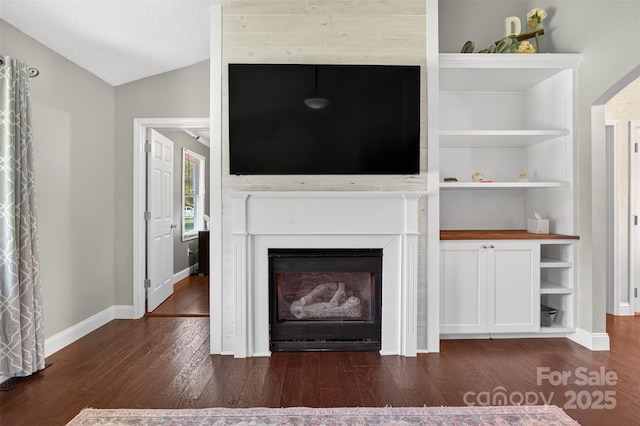 106 Abbey Cir, Salisbury, NC 28147 - unfurnished living room featuring dark wood finished floors, vaulted ceiling, and a fireplace
