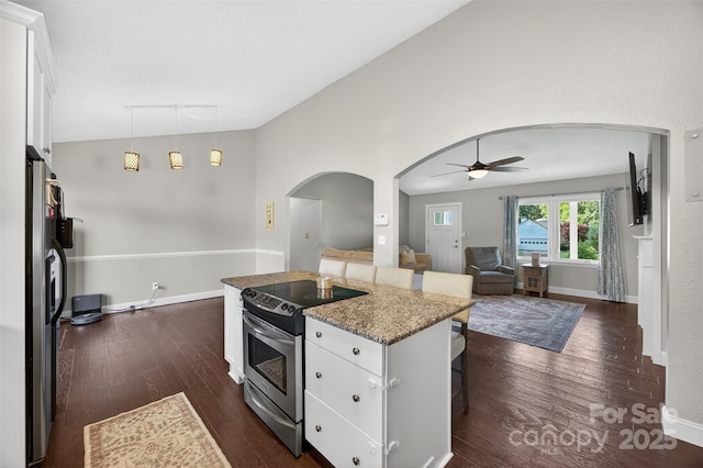 106 Abbey Cir, Salisbury, NC 28147 - kitchen featuring stainless steel appliances, arched walkways, dark wood-style floors, a kitchen breakfast bar, and ceiling fan