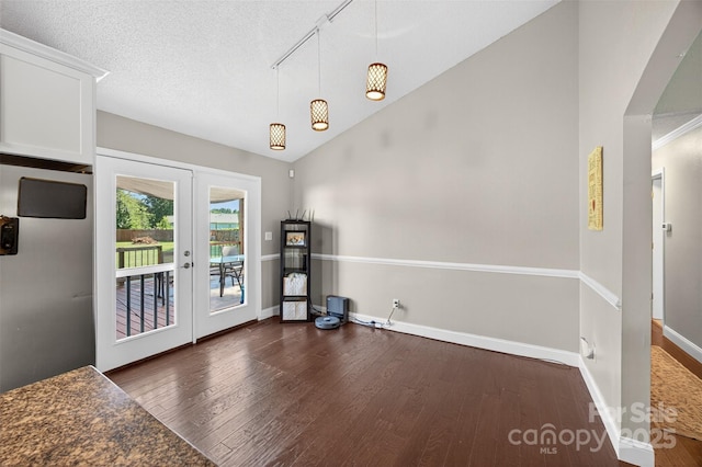 106 Abbey Cir, Salisbury, NC 28147 - unfurnished dining area with wood finished floors, french doors, lofted ceiling, and track lighting