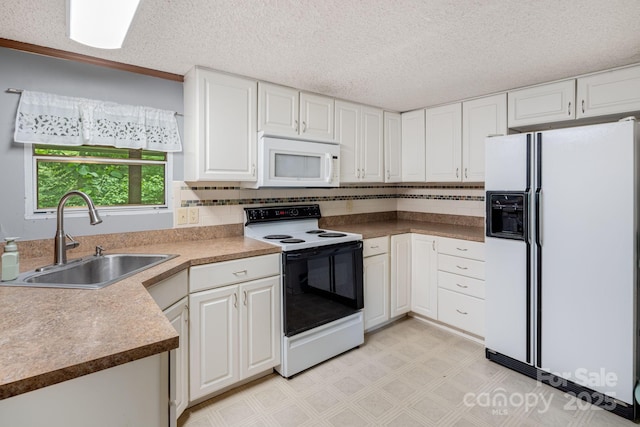 6 Kims Ct, Clyde, NC 28721 - kitchen with white appliances, light flooring, white cabinets, tasteful backsplash, and a textured ceiling
