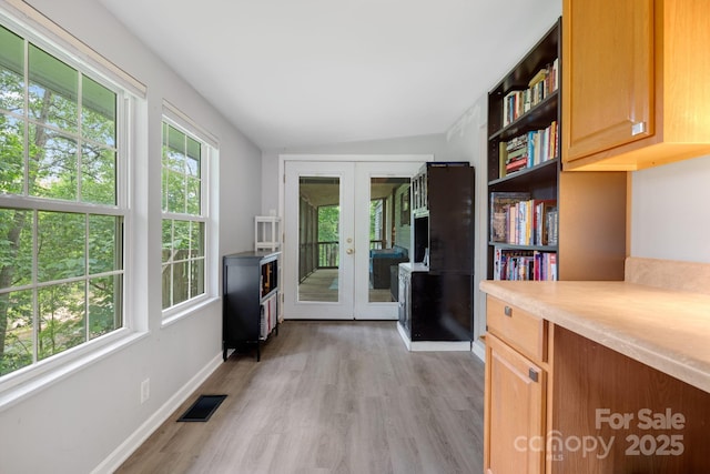6 Kims Ct, Clyde, NC 28721 - kitchen with french doors, light wood-type flooring, light countertops, and open shelves