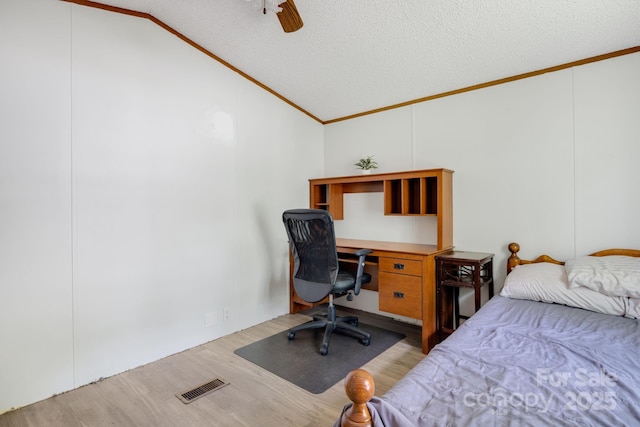 6 Kims Ct, Clyde, NC 28721 - bedroom featuring lofted ceiling, crown molding, wood finished floors, ceiling fan, and a desk