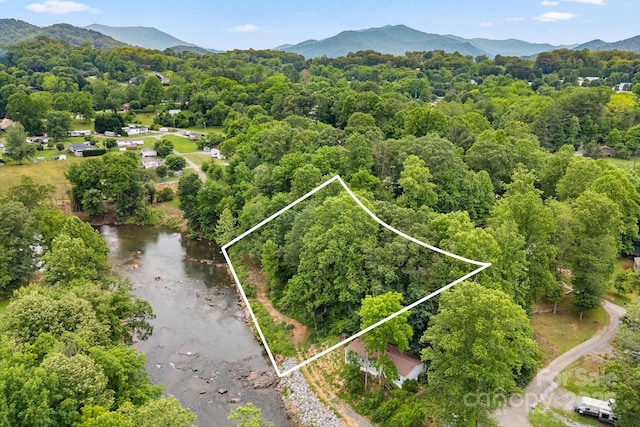6 Kims Ct, Clyde, NC 28721 - aerial view of property and surrounding area featuring property boundaries highlighted and a mountainous background