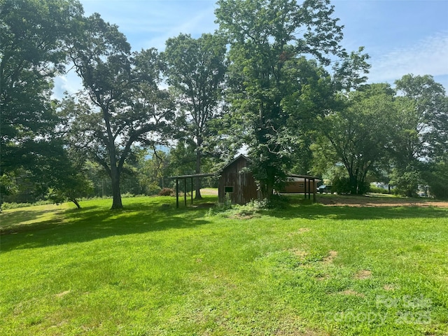 455 Cane Creek Rd, Fletcher, NC 28732 - view of grassy yard with a pole building and an outbuilding